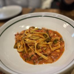 Tavernetta signature dishes Tagliatelle Bolognese, Burrata, Focaccia, Grilled Branzino